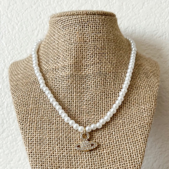 Jewelry - NEW | faux pearl necklace with rhinestone planet charm